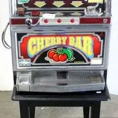 Vintage Cherry Bar slot machine on a black wooden stand, featuring classic fruit reels and a chrome finish.
