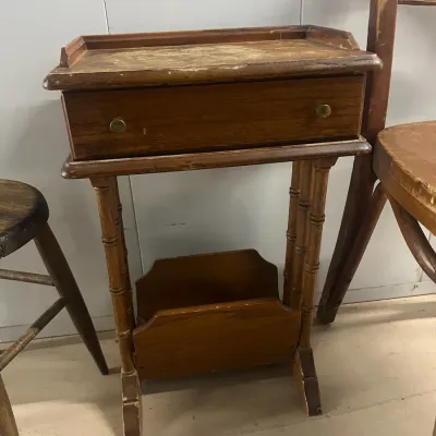 Sale Photo Thumbnail #36: Vintage wooden telephone table featuring a single drawer, faux-bamboo turned legs, and a built-in lower magazine rack, showing moderate surface wear.