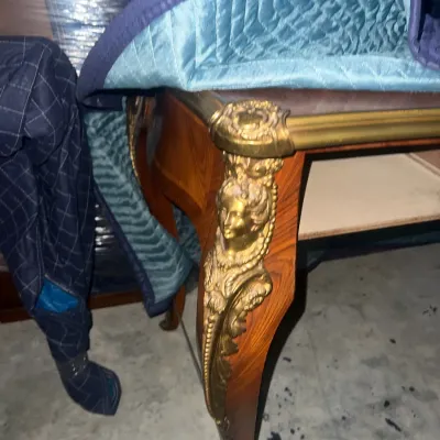 Sale Photo Thumbnail #64: French Louis XV style table leg featuring an ornate gilt bronze ormolu female bust mount on a curved wood leg.