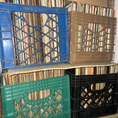 Sale Photo Thumbnail #93: Large collection of vintage vinyl LP records organized in colorful plastic milk crates.