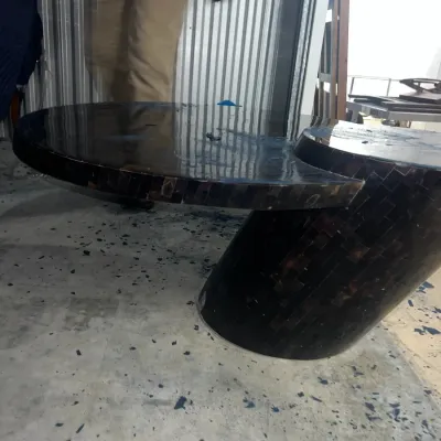 Sale Photo Thumbnail #70: Contemporary dark-toned coffee table featuring a glossy, tiled mosaic finish and a unique cantilevered design.