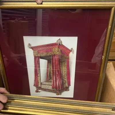 Sale Photo Thumbnail #17: Framed art print depicting an ornate, red and gold canopy bed, set within a deep red mat and a beaded gold-finished frame.