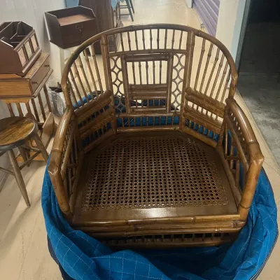 Sale Photo Thumbnail #45: Vintage faux bamboo and cane corner chair, featuring a rounded spindle back and woven cane seat.