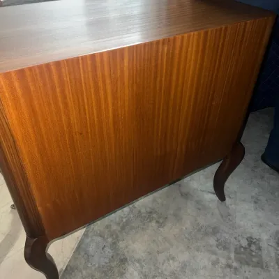 Sale Photo Thumbnail #90: Mid-century modern style wooden cabinet featuring a rich mahogany finish and elegant cabriole legs.
