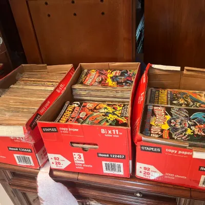 Sale Photo Thumbnail #95: Three Staples copy paper boxes filled with vintage comic books, including issues of Daredevil, Tomb of Dracula, and Doctor Strange.
