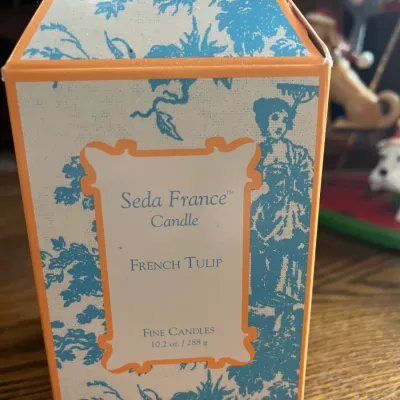 Seda France French Tulip scented candle in its original pagoda-style box, featuring a blue toile pattern with orange trim.
