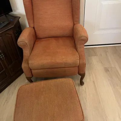 Two upholstered chairs and one ottoman