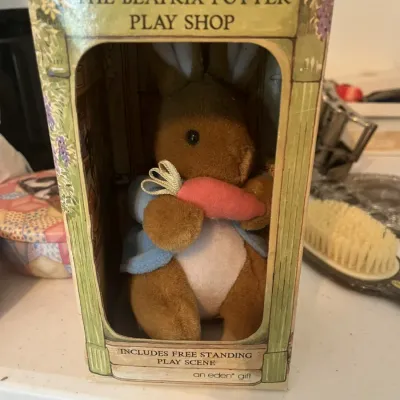 Vintage Eden Toys Beatrix Potter Peter Rabbit plush in its original "Play Shop" display box, featuring a free-standing play scene.