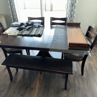Sale Photo Thumbnail #548: Measures approx. 42x64", already has one leaf inserted and comes with another. Four chairs and one bench.