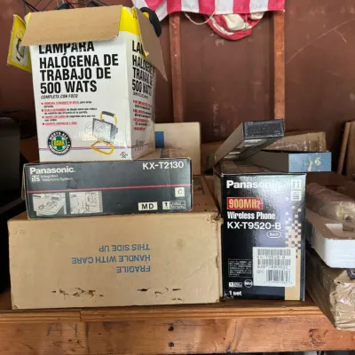 Assorted vintage electronics and hardware in original boxes, including a Panasonic KX-T2130 integrated telephone system, a Panasonic...