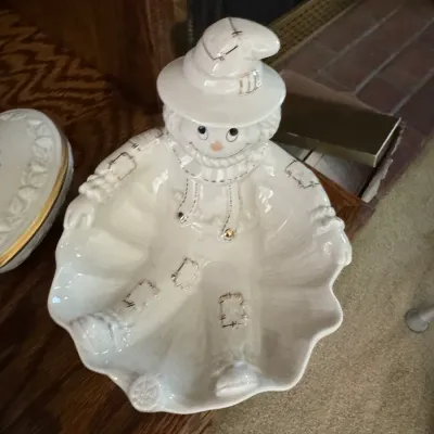 Vintage white ceramic scarecrow candy dish with gold-accented stitching details, in excellent condition.