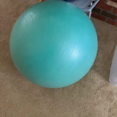 Sale Photo Thumbnail #154: Teal inflatable exercise stability ball with textured ridges, shown in gently used condition.