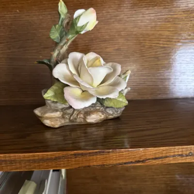 Sale Photo Thumbnail #142: Vintage porcelain rose figurine featuring a blooming white rose and a single bud on a textured branch base.
