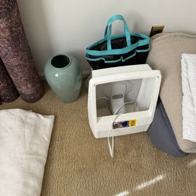 Dr. Scholl's Foot Bath Plus, a light blue ceramic vase, and a black mesh shower caddy tote with blue handles.