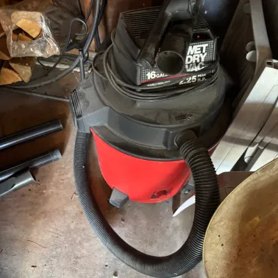 Vintage Craftsman 16-gallon wet/dry shop vacuum with a 4.25 peak horsepower motor, showing some dust and wear from garage storage.