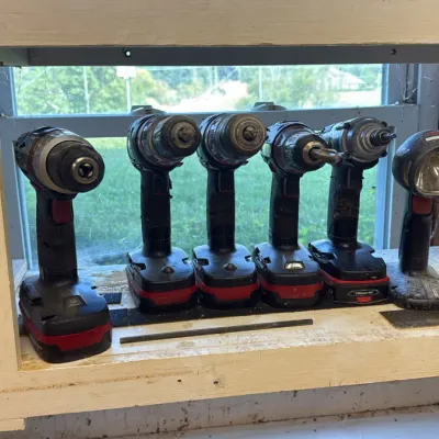 Assortment of Craftsman C3 19.2V cordless power tools, including multiple drills, an impact driver, and a work light, showing signs of...