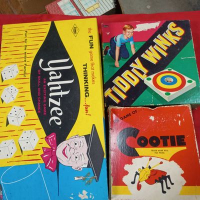 Sale Photo Thumbnail #35: An Assortment of Vintage Board Games Including Yahtzee, Cootie, and Tiddly Winks with a Tin Toy House