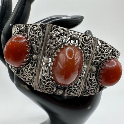 Filigree Panel Bracelet with Faux Red Cabochon Oval Setting Ornate Motifs