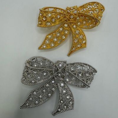 Sale Photo Thumbnail #188: Kenneth Jay Lane Pair of Rhinestone Bow Brooches Gold and Silver Tone KJL