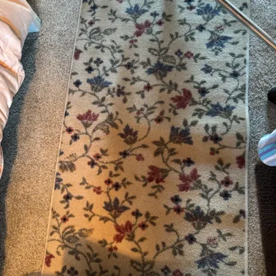 Sale Photo Thumbnail #149: Traditional floral runner rug featuring a vine pattern with red and blue blossoms on a beige background.