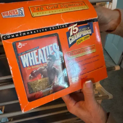 Wheaties 75th Anniversary Commemorative Edition 24K Gold Signature mini box collectible featuring Muhammad Ali, in its original packaging.