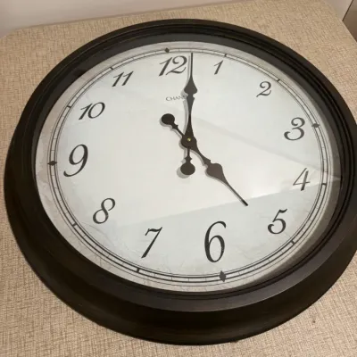Large Chaney wall clock featuring a dark brown frame, a white face with large black numerals, and ornate black hands.