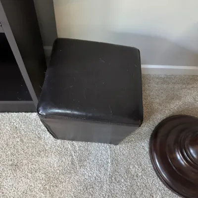 Sale Photo Thumbnail #265: Dark brown faux leather cube storage ottoman, showing some light surface wear and pet hair.
