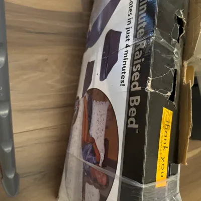 Sale Photo Thumbnail #179: Aerobed 4-Minute Raised Bed inflatable mattress in its original, worn box wrapped in plastic.