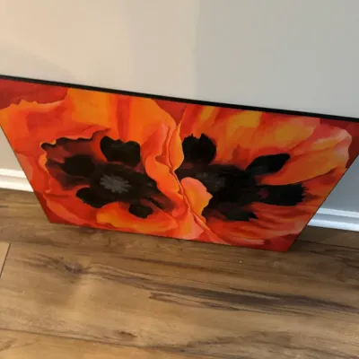 Large canvas wall art featuring a vibrant, close-up painting of two orange and red poppy flowers with dark centers.