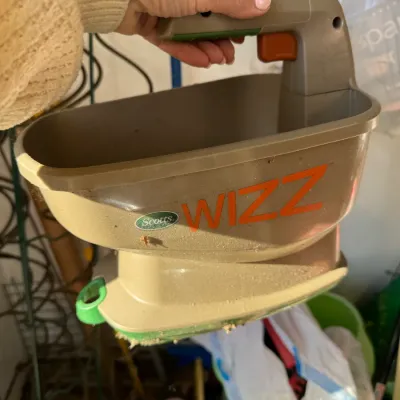Sale Photo Thumbnail #216: Scotts Wizz hand-held battery-powered spreader, showing some light wear from use.