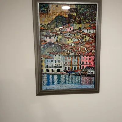 Sale Photo Thumbnail #279: Framed print of Gustav Klimt's "Malcesine on Lake Garda," presented in a silver-toned frame under glass.