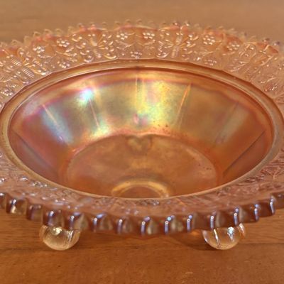 Three Footed Marigold Carnival Glass Bowl in the Butterfly and Berry Pattern