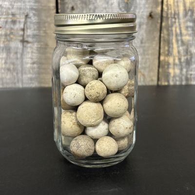 Sale Photo Thumbnail #431: A Collection of Antique Hand-Rolled Clay Marbles in a Glass Jar