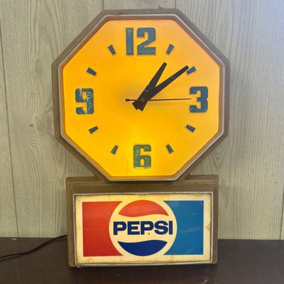 Sale Photo Thumbnail #714: Vintage Pepsi-Cola Illuminated Advertising Wall Clock by Impact International Inc.