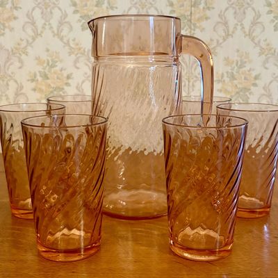 A Seven Piece French Pink Glass Beverage Set in Swirl Pattern