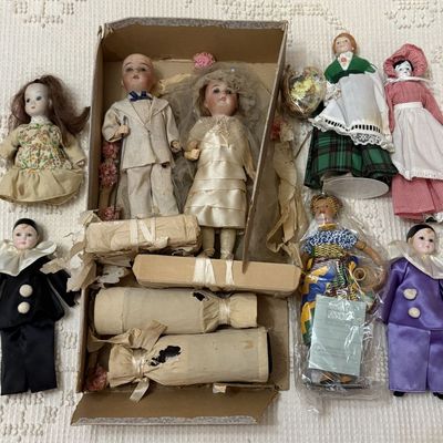 Sale Photo Thumbnail #491: A Group of Bisque and Porcelain Collectible Dolls Including Nigerian Adama for Avon