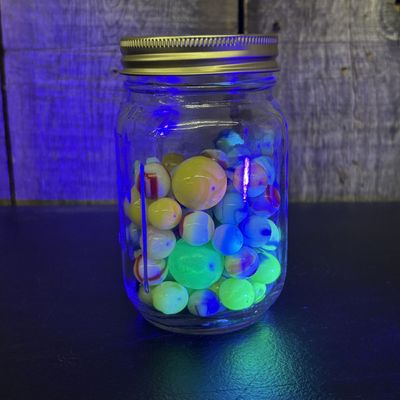 Sale Photo Thumbnail #309: A Collection of Vintage Glass Marbles in a Glass Storage Jar