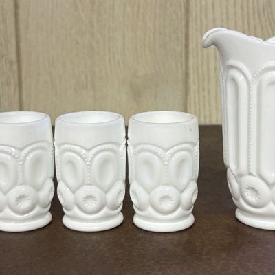 Sale Photo Thumbnail #698: A Set of Moon and Star Pattern Milk Glass Miniature Pitcher and Tumblers
