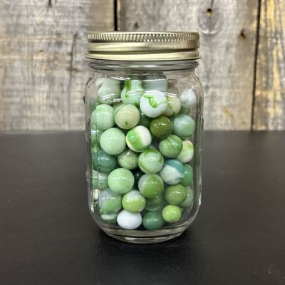 Sale Photo Thumbnail #656: A Collection of Vintage Glass Marbles in a Graduated Mason Jar