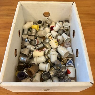 Sale Photo Thumbnail #531: An Assortment of Antique and Vintage Metal, Porcelain, and Wood Thimbles