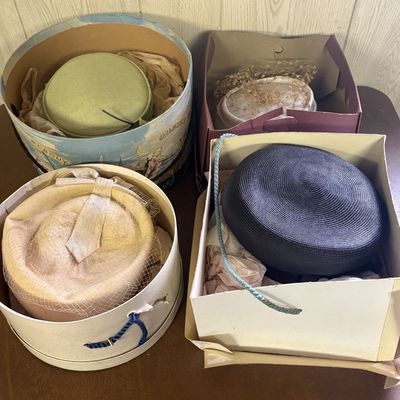Sale Photo Thumbnail #719: Collection of Four Mid-Century Women's Pillbox and Toque Hats with Illustrated Hat Boxes