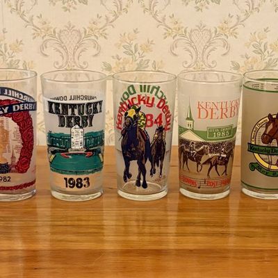 Sale Photo Thumbnail #395: A Collection of Nine Official Kentucky Derby Mint Julep Glasses from 1980 to 1989