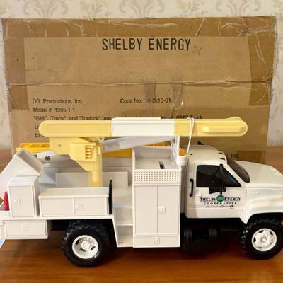 Sale Photo Thumbnail #541: DG Productions Shelby Energy Cooperative GMC TopKick Promotional Bucket Truck with Original Box