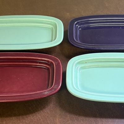 Sale Photo Thumbnail #710: A Set of Four Homer Laughlin Fiesta Ceramic Butter Dish Bases