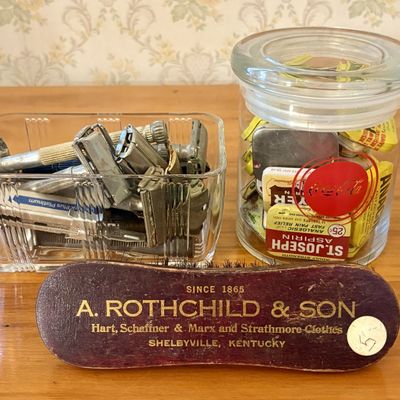 Sale Photo Thumbnail #536: A Group of Vintage Safety Razors, Medicinal Tins in a Coca-Cola Jar, and Promotional Clothes Brush