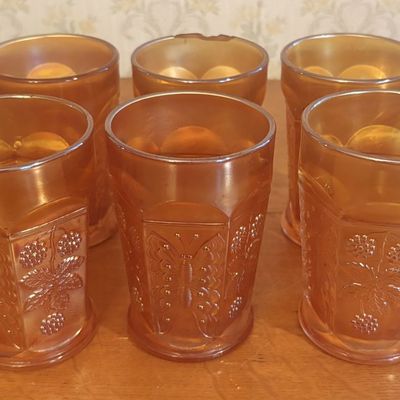 A Set of Six Marigold Carnival Glass Butterfly and Berry Tumblers