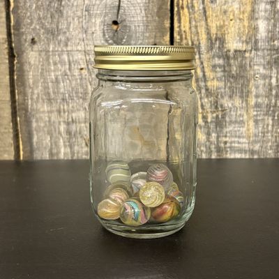 Sale Photo Thumbnail #305: A Collection of Antique and Vintage Glass Latticinio and Swirl Marbles in a Glass Jar
