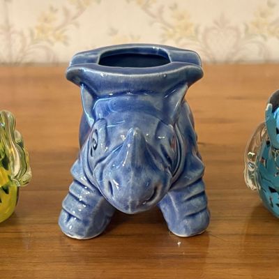 Sale Photo Thumbnail #572: Three Animal Themed Decorative Objects Including Two Blown Glass Bird Figurines and a Ceramic Rhinoceros Vessel