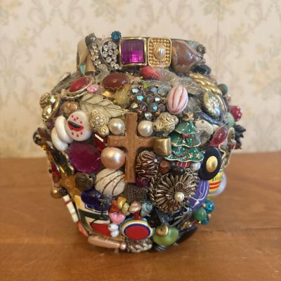 Sale Photo Thumbnail #269: A Folk Art Memory Ware Vessel Encrusted with Found Objects and Costume Jewelry