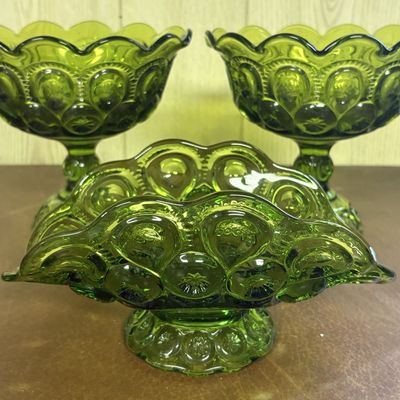 Sale Photo Thumbnail #680: Three Piece Set of Moon and Star Pattern Olive Green Pressed Glass Pedestal Compotes and Bowl